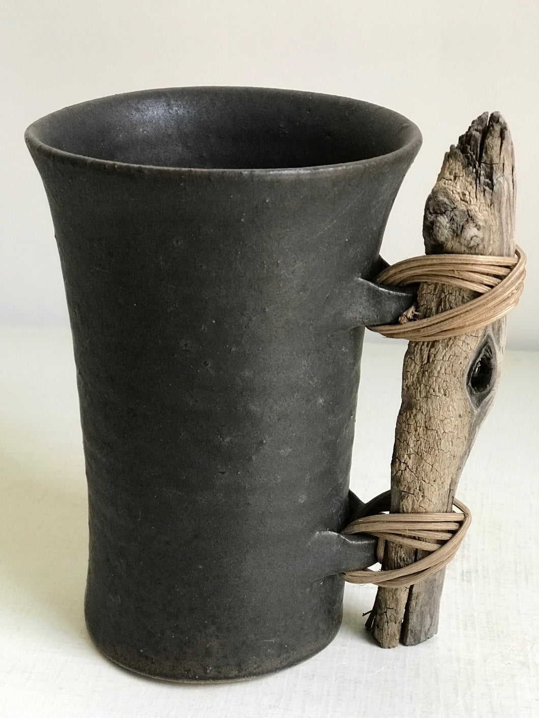 Cup with stick by Anne Fallis Elliot